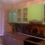 Бежево-зеленый угловой кухонный гарнитур с дверями из МДФ