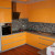 Желтый угловой кухонный гарнитур 9 кв.м в частном доме