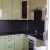 Двухцветный угловой кухонный гарнитур с глянцевыми фасадами