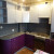 Фиолетовая угловая кухня с радиусным фасадом