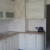 Белый классический угловой кухонный гарнитур с радиусными фасадами