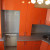 Оранжевый угловой кухонный гарнитур с фасадами из МДФ