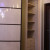 Угловой белый радиусный шкаф купе в коридор