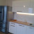 Белая угловая кухня в скандинавском стиле 10 кв.м с глянцевыми фасадами