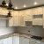 Белый угловой кухонный гарнитур с фигурными фасадами