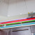Двухцветный угловой гарнитур для малогабаритной кухни в студии