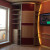Угловой радиусный шкаф купе в гостинную с дверями из экокожи