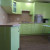 Большой зелёный угловой кухонный гарнитур с пеналами