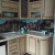 Коричневый угловой кухонный гарнитур с радиусными фасадами