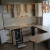 Бежевый угловой кухонный гарнитур с радиусными фасадами