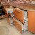 Двухцветный оранжевый кухонный гарнитур с радиусными фасадами