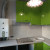 Зелёный угловой кухонный гарнитур с радиусным фасадом