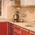 Красный угловой кухонный гарнитур с радиусными фасадами