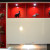 Чёрно-белый угловой кухонный гарнитур 11 кв.м с красными витринами