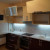 Черно-бежевый радиусный кухонный гарнитур с глянцевыми дверями